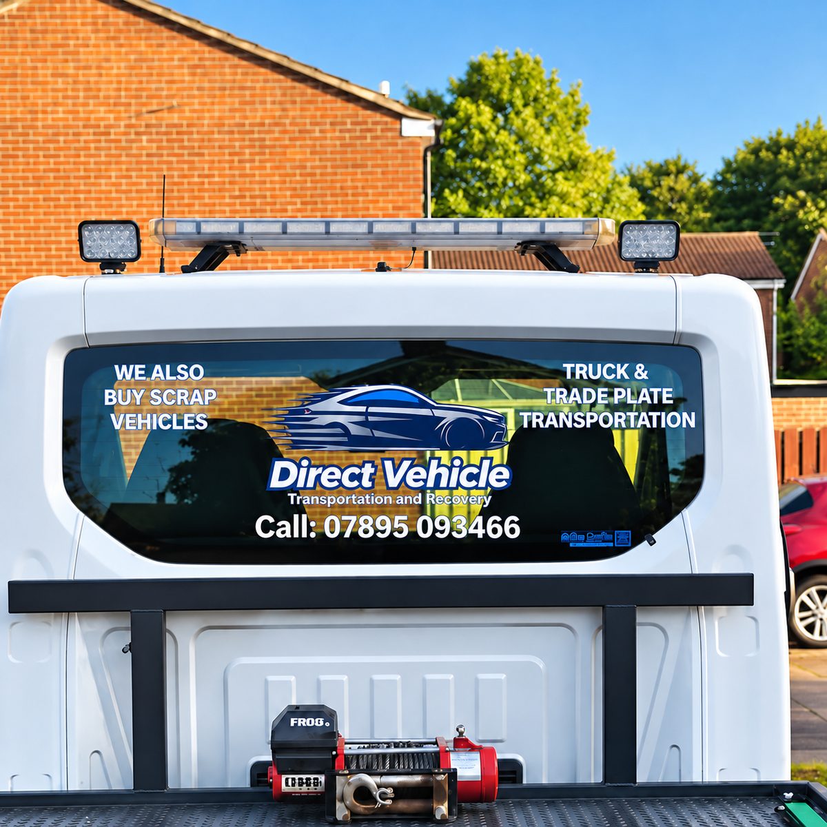 Rear cab window of the transporter showing the Direct Vehicle logo